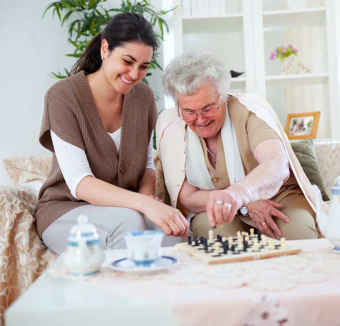 smiling people playing chess
