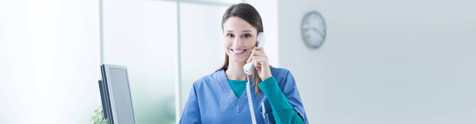 woman holding a telephone